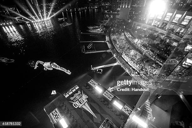 In this handout image provided by Red Bull, Artem Silchenko of Russia dives from the 27 metre platform on the Dubai Marina Pier 7 building during the...