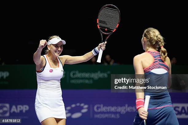 Elena Vesnina and Ekaterina Makarova of Russia celebrate victory in their doubles match against Andrea Hlavackova and Lucie Hradecka of Czech...