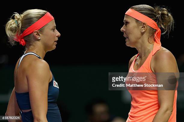Andrea Hlavackova and Lucie Hradecka of Czech Republic talk in their doubles match against Elena Vesnina and Ekaterina Makarova of Russia during day...