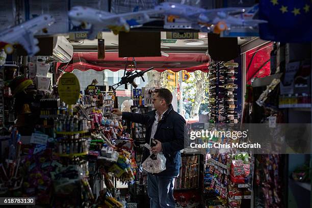 Man shops at a news media kiosk in the upper class neighbourhood of Nisantasi on October 22, 2016 in Istanbul, Turkey. Media outlets have been hit...