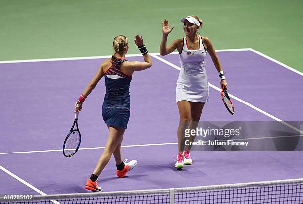Elena Vesnina and Ekaterina Makarova of Russia celebrate in their doubles match against Andrea Hlavackova and Lucie Hradecka of Czech Republic during...