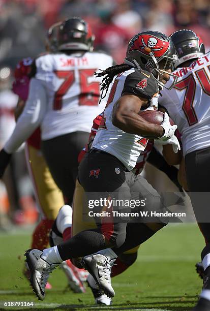 Jacquizz Rodgers of the Tampa Bay Buccaneers carries the ball against the San Francisco 49ers during the first quarter of an NFL football game at...