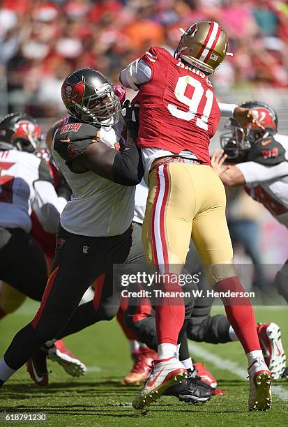 Demar Dotson of the Tampa Bay Buccaneers blocks Arik Armstead of the San Francisco 49ers during the first quarter of an NFL football game at Levi's...