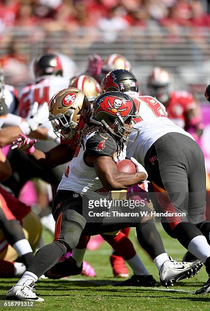 Jacquizz Rodgers of the Tampa Bay Buccaneers carries the ball against the San Francisco 49ers during the first quarter of an NFL football game at...