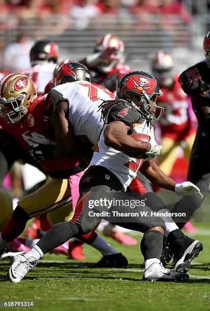 Jacquizz Rodgers of the Tampa Bay Buccaneers carries the ball against the San Francisco 49ers during the first quarter of an NFL football game at...