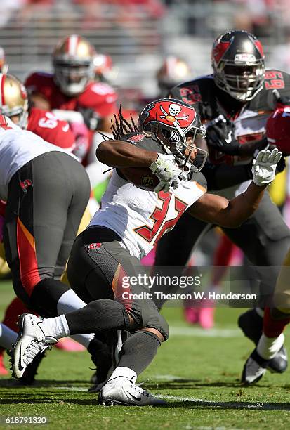 Jacquizz Rodgers of the Tampa Bay Buccaneers carries the ball against the San Francisco 49ers during the first quarter of an NFL football game at...