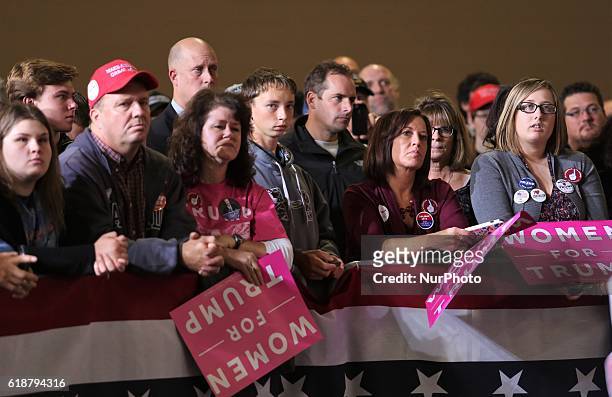 Supporters hold signs during a campaign rally at SeaGate Center in Toledo, Ohio, United States on October 27, 2016.