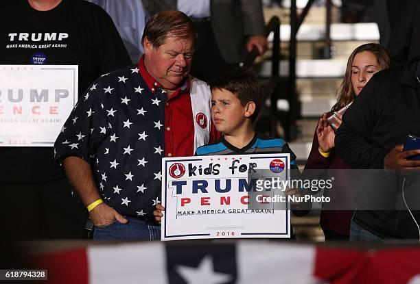 Child holds a sign during a campaign rally at SeaGate Center in Toledo, Ohio, United States on October 27, 2016.