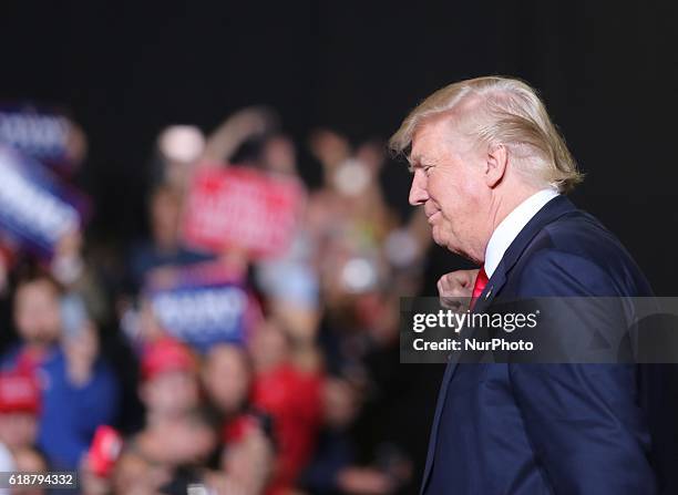 Donald Trump greets supporters as he approaches the stage during a campaign rally at SeaGate Center in Toledo, Ohio, United States on October 27,...