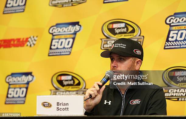 Brian Scott, driver of the American Red Cross Ford, speaks to the media at Martinsville Speedway on October 28, 2016 in Martinsville, Virginia.