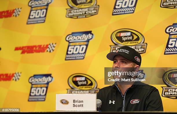 Brian Scott, driver of the American Red Cross Ford, speaks to the media at Martinsville Speedway on October 28, 2016 in Martinsville, Virginia.