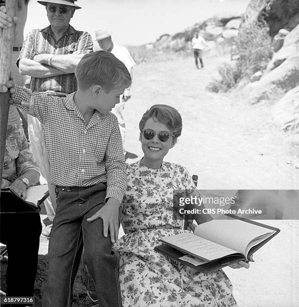 Jon Provost with June Lockhart behind the scenes of the CBS television show, Lassie episode, Lassie to the Rescue. Image dated June 25, 1963....