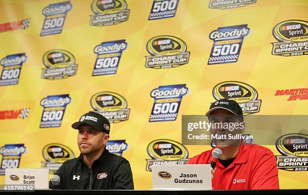 Brian Scott, driver of the American Red Cross Ford, and Jason Gudzunas speak to the media at Martinsville Speedway on October 28, 2016 in...
