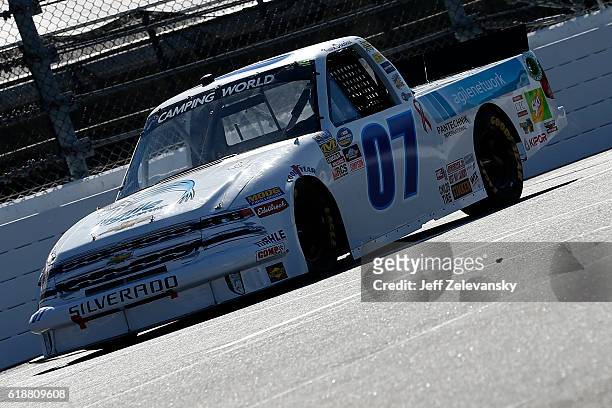 Kevin Donahue, driver of the Agile Network Chevrolet, practices for the NASCAR Camping World Truck Series Texas Roadhouse 200 presented by Alpha...