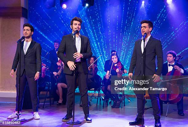 Are seen performing on the set of "Despierta America at Univision Studios on October 28, 2016 in Miami, Florida.