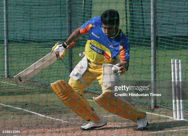 Chennai Super King's captain MS Dhoni bats during the team's practice session at Ballville, Cape Town