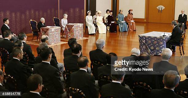 Japan - Emperor Akihito, Empress Michiko and other imperial family members attend a lecture given by a top researcher Jan. 10 during the annual...