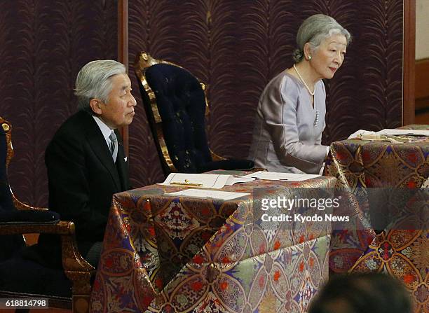 Japan - Emperor Akihito and Empress Michiko attend a lecture from a top researcher Jan. 10 during the annual "kosho hajime no gi" event, part of the...