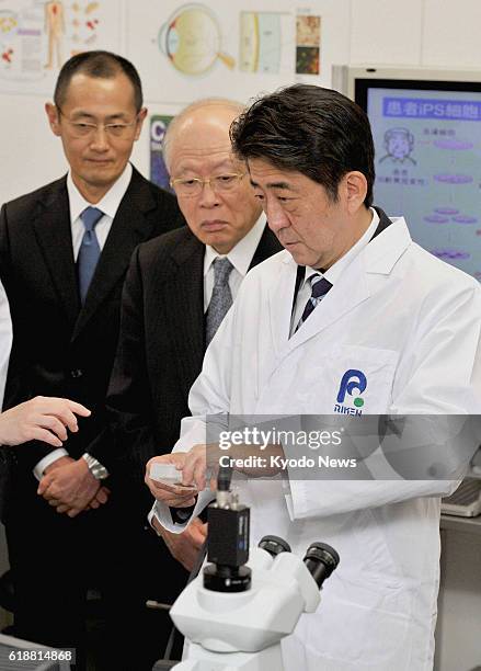 Japan - Japanese Prime Minister Shinzo Abe visits a laboratory belonging to Riken, a company that deals with the research of induced pluripotent stem...