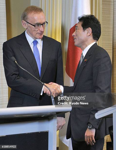 Australia - Japanese Foreign Minister Fumio Kishida and Australian counterpart Bob Carr shake hands after holding a news conference following their...