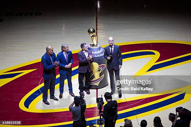 Commissioner, Adam Silver presents the Owner of the Cleveland Cavaliers, Dan Gilbert with his championship ring before the game against the New York...