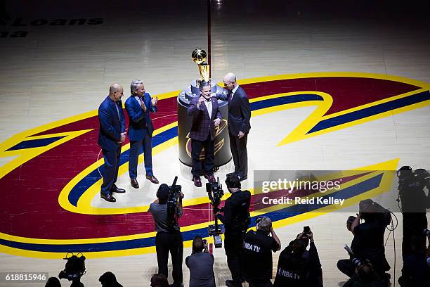 Commissioner, Adam Silver presents the Owner of the Cleveland Cavaliers, Dan Gilbert with his championship ring before the game against the New York...