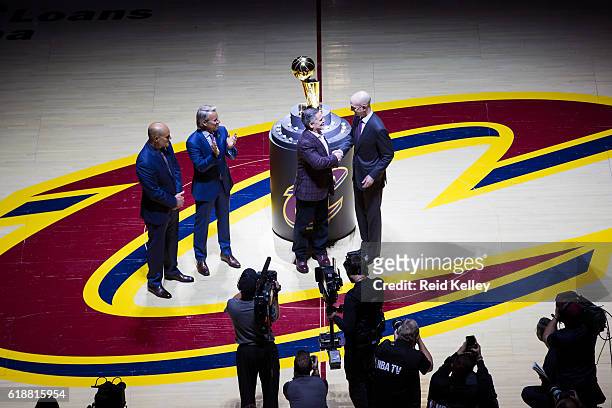Commissioner, Adam Silver presents the Owner of the Cleveland Cavaliers, Dan Gilbert with his championship ring before the game against the New York...