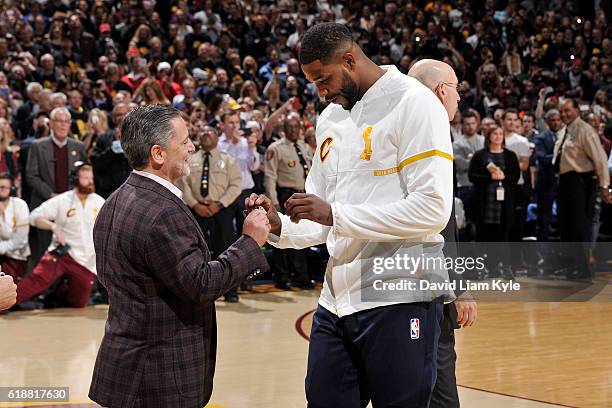 Tristan Thompson gets his championship ring presented to him by Dan Gilbert, Owner of the Cleveland Cavaliers, before the game against the New York...