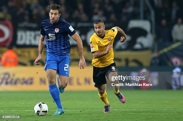 Patrick Schoenfeld of Braunschweig battles for the ball with Akaki Gogia of Dresden during the Second Bundesliga match between SG Dynamo Dresden and...