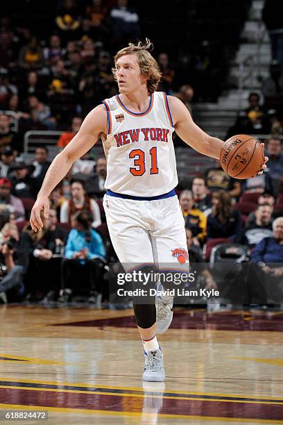 Ron Baker of the New York Knicks dribbles the ball against the Cleveland Cavaliers on October 25, 2016 at Quicken Loans Arena in Cleveland, Ohio....