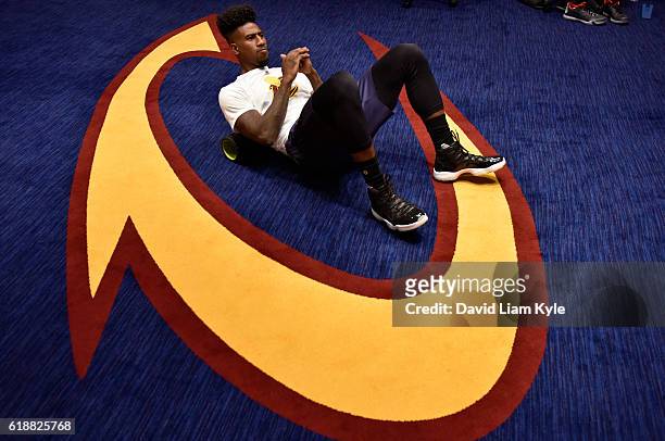 Iman Shumpert of the Cleveland Cavaliers stretches before the game against the New York Knicks on October 25, 2016 at Quicken Loans Arena in...
