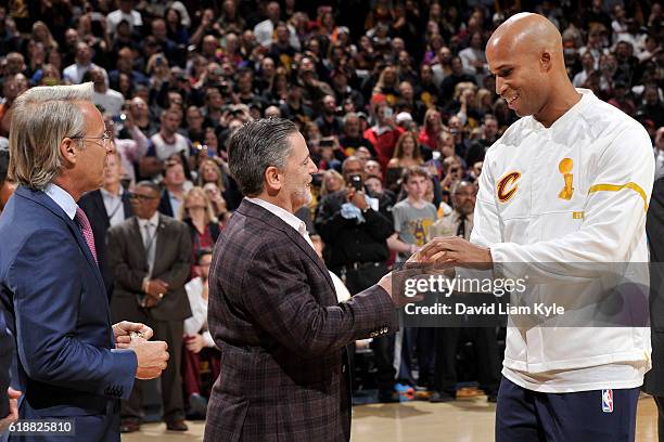 Owner, Dan Gilbert presents Richard Jefferson of the Cleveland Cavaliers with his championship ring before the game against the New York Knicks on...