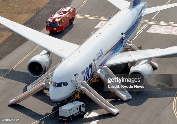 Japan - Photo from a Kyodo News helicopter shows a Boeing 787 jet operated by All Nippon Airways Co. On Jan. 16 at Takamatsu Airport, western Japan,...