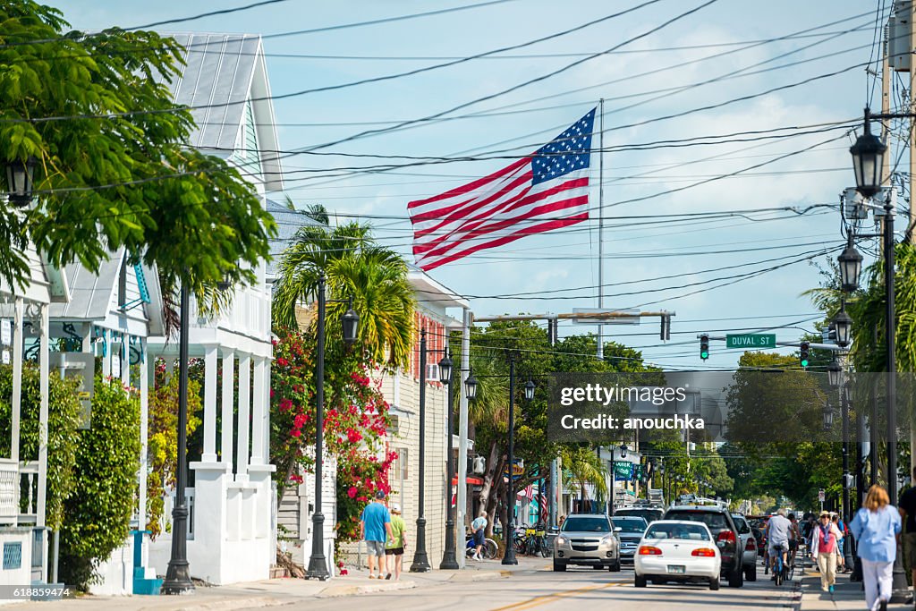 Key West street with giant American Flag, Florida, USA
