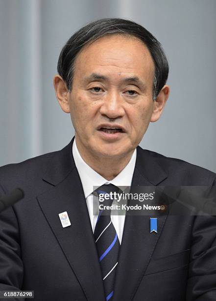 Japan - Chief Cabinet Secretary Yoshihide Suga tells a press conference at the prime minister's office in Tokyo on Jan. 21 that seven Japanese...