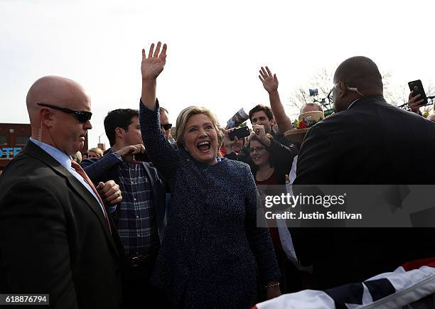 Democratic presidential nominee former Secretary of State Hillary Clinton greets supporters during a campaign rally on October 28, 2016 in Cedar...