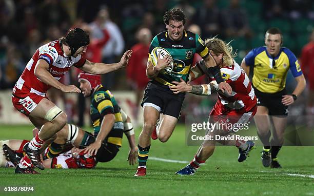 Lee Dickson of Northampton charges upfield during the Aviva Premiership match between Northampton Saints and Gloucester Rugby at Franklin's Gardens...