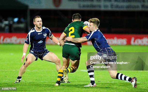 Australia's Josh Mansour is stopped in his tracks by Scotland's Euan Aitken and Scotland's Ben Hellewell during the Four Nations match between the...