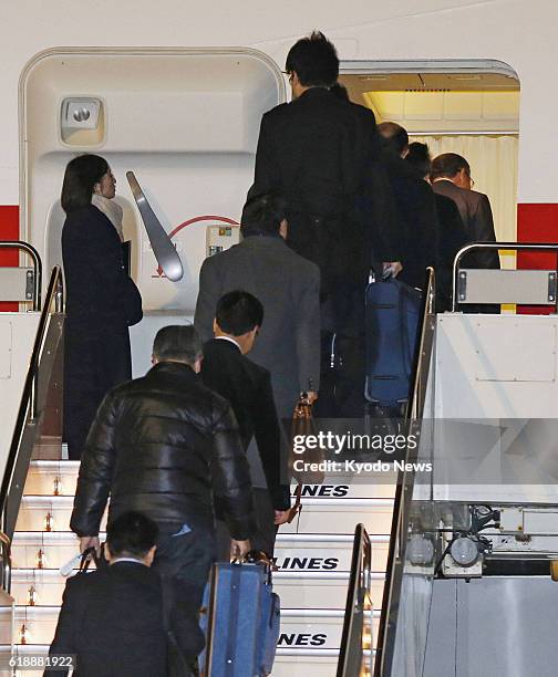 Japan - People board a Japanese government aircraft at Haneda airport in Tokyo on Jan. 22 ahead of its departure for Algeria. Tokyo dispatched the...