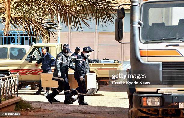 Algeria - Paramedics carry a coffin into a hospital in In Amenas, Algeria, on Jan. 21 where the bodies of some of the victims of a hostage crisis...