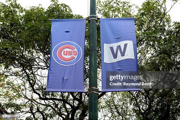 Cubs banner and 'W' banner hangs on Sheffield Avenue outside Wrigley Field, home of the Chicago Cubs baseball team to celebrate the Cubs' World...