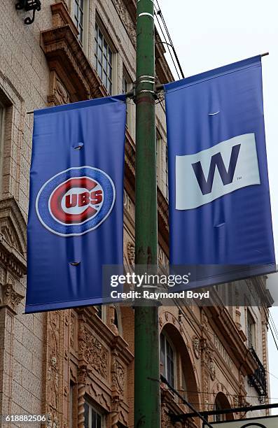 Cubs banner and 'W' banner hangs on Clark Street outside Wrigley Field, home of the Chicago Cubs baseball team to celebrate the Cubs' World Series...