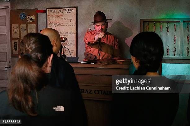 Sargent Gunter processes prisoners into Alcatraz at The San Francisco Dungeon's opening of the new 'Escape Alcatraz' drop ride and show on October...