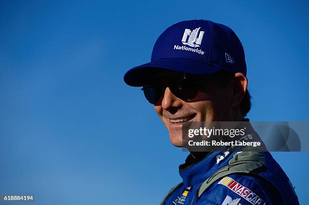 Jeff Gordon, driver of the Nationwide Chevrolet, stands on the grid prior to qualifying for the NASCAR Sprint Cup Series Goody's Fast Relief 500 at...