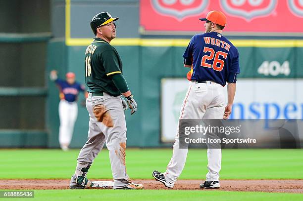 Oakland Athletics First base Billy Butler reacts to being called out as Houston Astros infielder Danny Worth looks on and Houston Astros center...