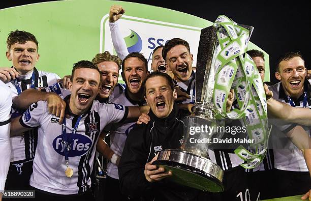 Louth , Ireland - 28 October 2016; Dundalk assistant manager Vinny Perth celebrates with the trophy after the SSE Airtricity League Premier Division...