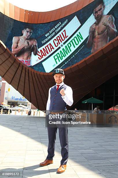 Carl Frampton poses in front of the marquee advertising his fight against Leo Santa Cruz at the Barclays Center in Brooklyn, NY.