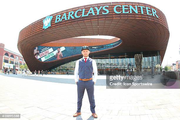 Carl Frampton poses in front of the marquee advertising his fight against Leo Santa Cruz at the Barclays Center in Brooklyn, NY.