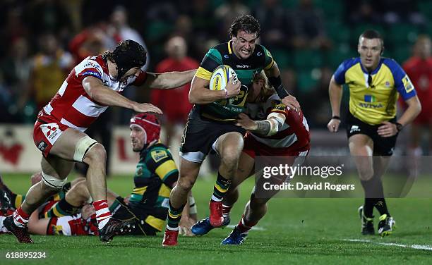 Lee Dickson of Northampton breaks with the ball during the Aviva Premiership match between Northampton Saints and Gloucester Rugby at Franklin's...