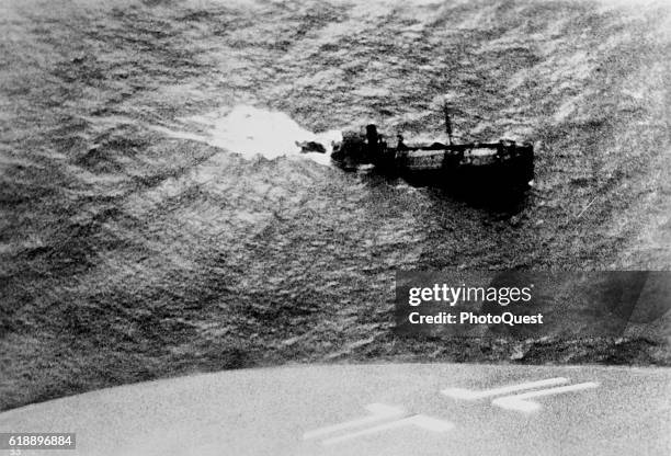 View of an unidentified British cargo ship as it sinks in the North Atlantic, March 1940. The photo was taken from the German plane that attcked it.